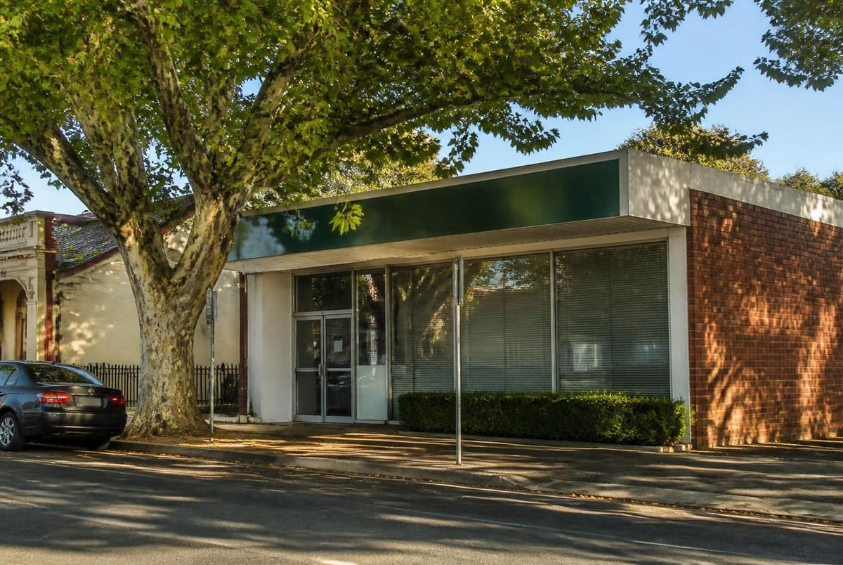 The practice frontage on a quiet Norwood street, with a large plane tree shading the footpath and the front door.